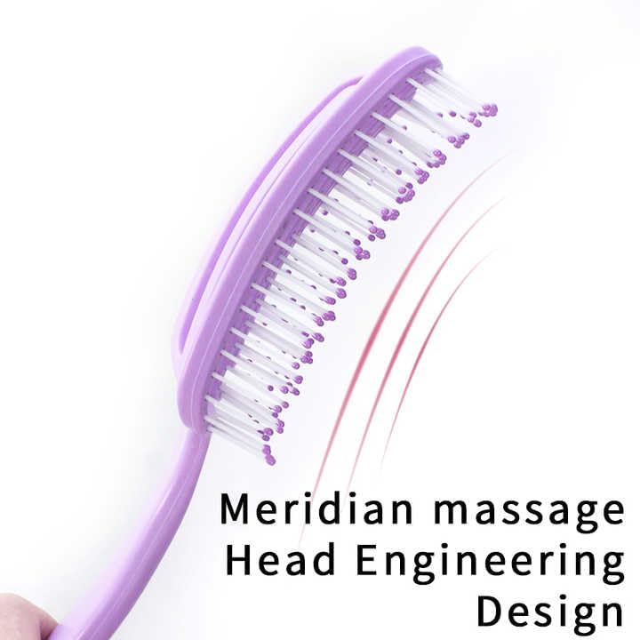 Side profile of the curved bristle head on the detangling brush designed to fit the scalp