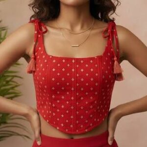 Back view of the red Myntra Boho Outfit top showing the lace-up string ties and tassels
